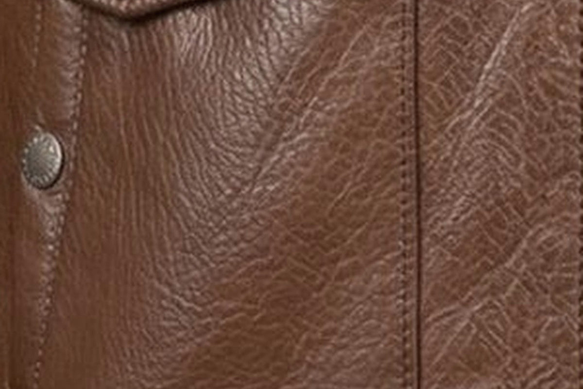 Pebble-grain calfskin, close — the surface that conditioning keeps alive